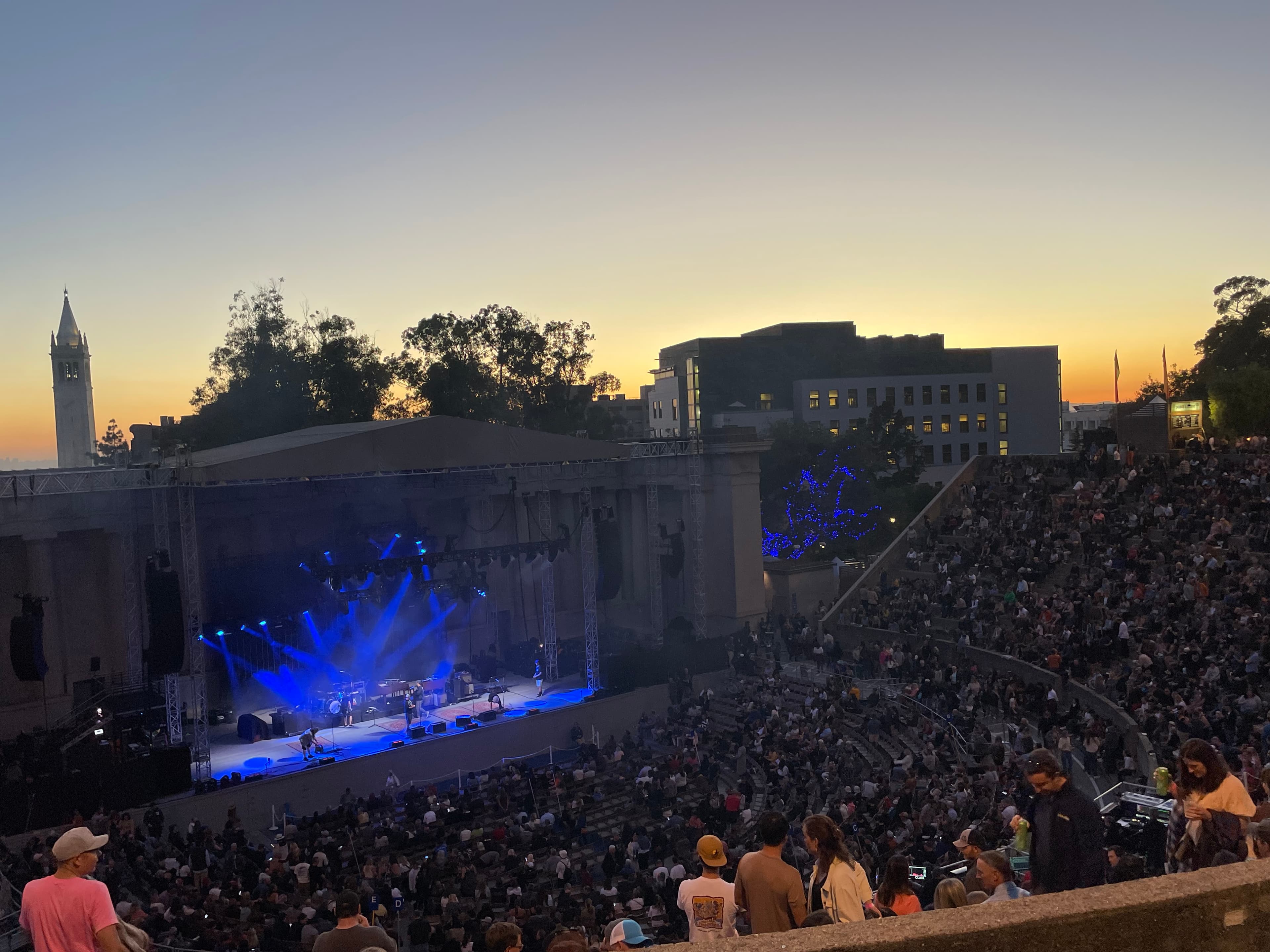 A packed amphitheatre at sunset: the Greek Theatre.